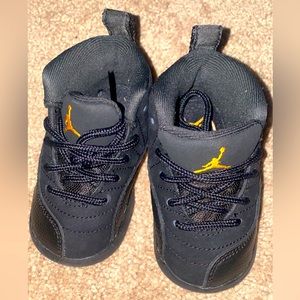 Jordan 12 Retro Toddler Shoes “Black/Taxi”.